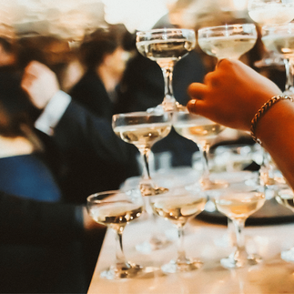 Candlelit bar with signature drink sign