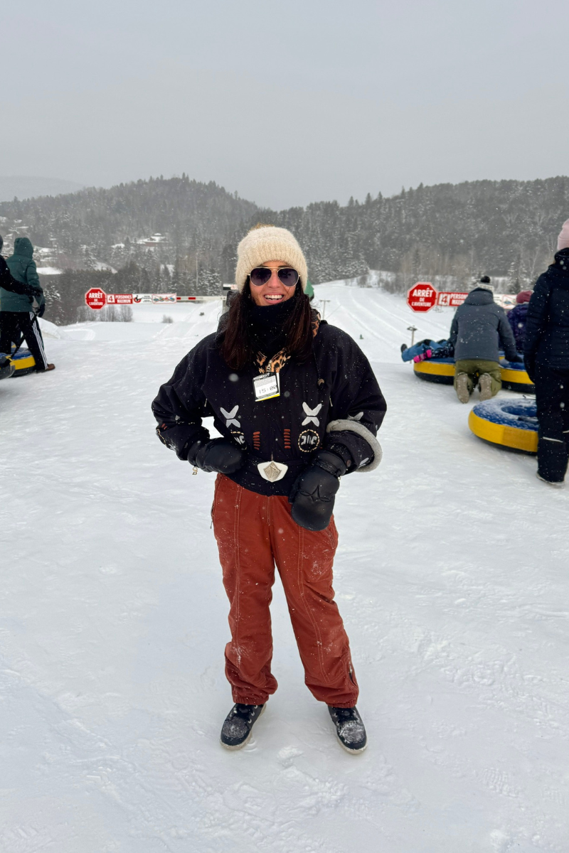 Snow tubing hill at Aventures Neige in Mont-Tremblant with visitors riding yellow tubes down snowy s