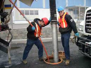 High-pressure jetting equipment cleaning underground sewer line