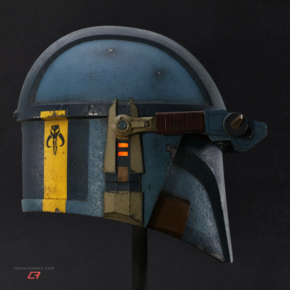 Mynock’s Den "Kobalt" fully-finished Mandalorian "Recon Large" helmet, with a weathered blue textured paintjob, orange T-visor, orange ear LEDs, and lowered lighted MHAS Macrobinoculars. Right side profile view.
