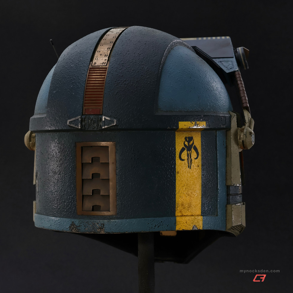 Mynock’s Den "Kobalt" fully-finished Mandalorian "Recon Large" helmet, with a weathered blue textured paintjob, orange T-visor, orange ear LEDs, and raised MHAS Macrobinoculars. Rear-right view.