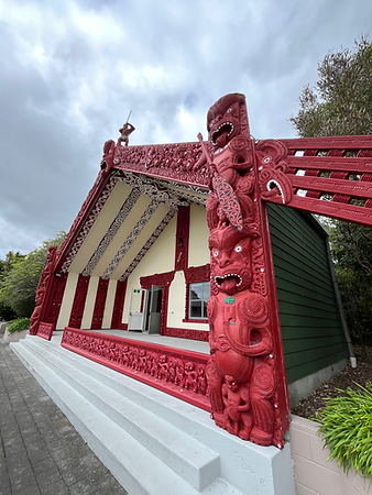 Intricately carved Maori meeting house