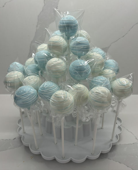 Blue and white cake pops on white stand for baby shower in GTA