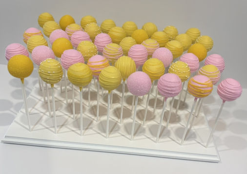 Pink and yellow cake pop display for wedding anniversary in Milton