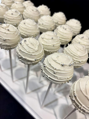Elegant white bridal shower cake pops with silver pearls and luster dust in GTA