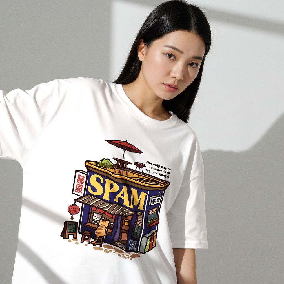 White crew neck t-shirt featuring a detailed cartoon graphic of a cat sitting in front of a "SPAM" shop.