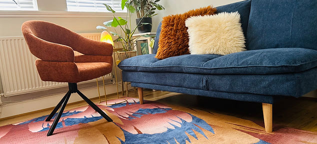 Chris Kane Quantum Healing therapy room with blue sofa.
