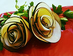 Black radish roses garnish on a white plate with fresh parsley — Link to Black Radish section.
