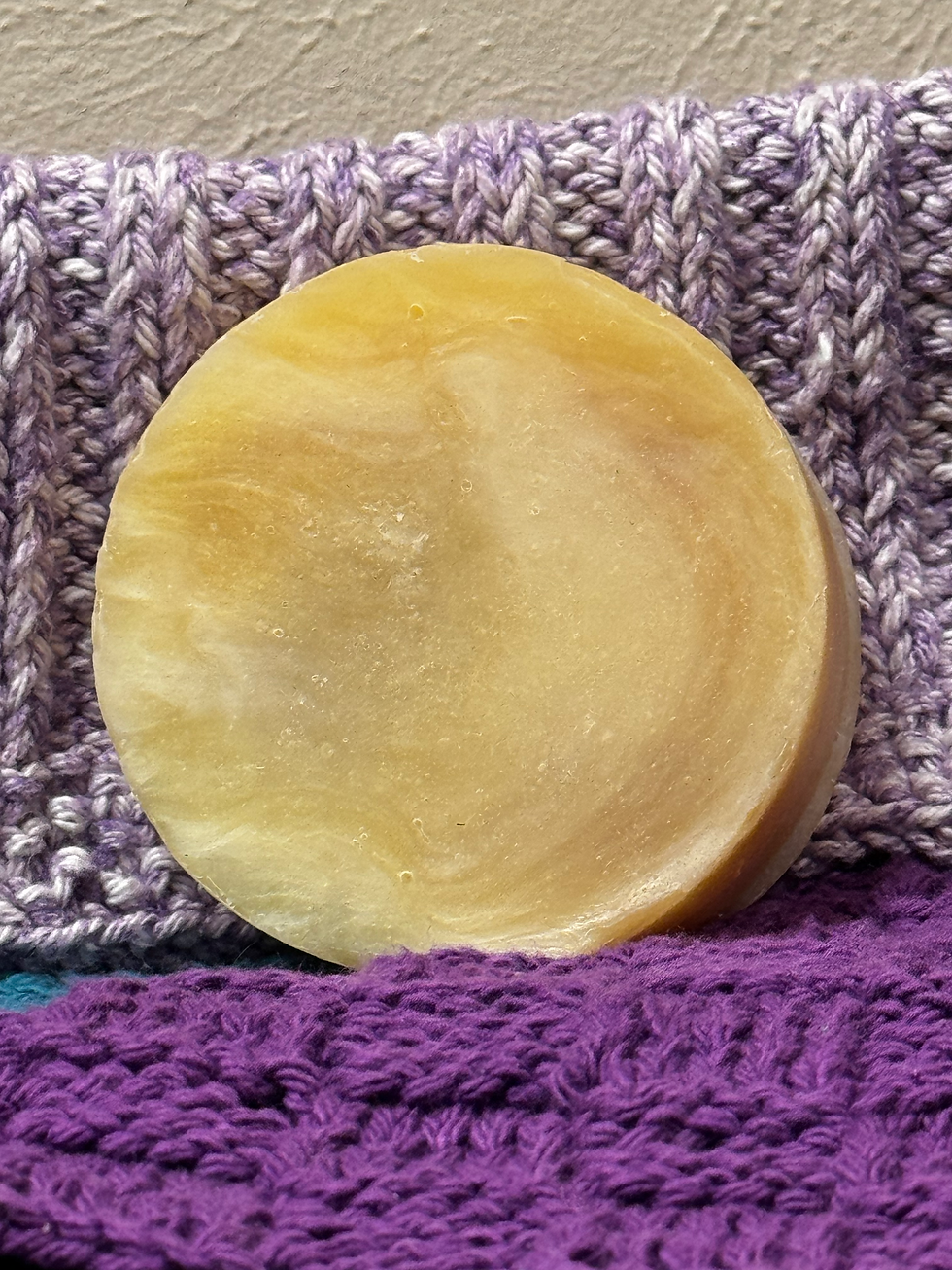 bar of pure patchouli soap on hand-knit washcloths.