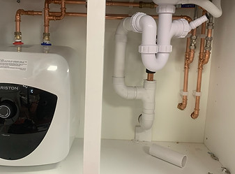 under sink plastic and copper pipework