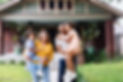 Portrait of Multiracial Parents Holding Their Kids in Front of the House - Edited.jpg