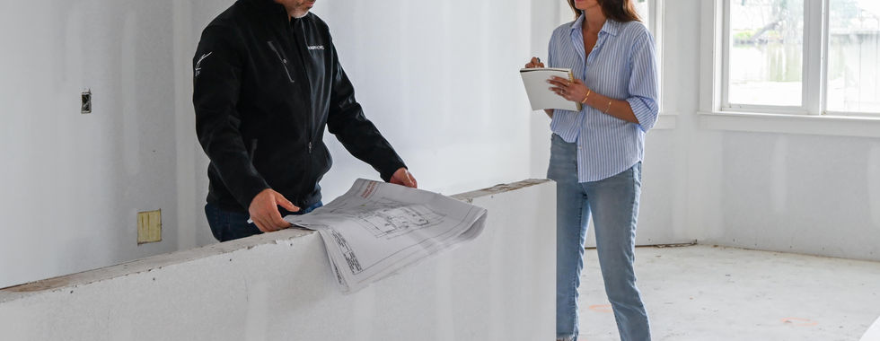 Builders discussing custom home blueprints