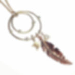 Custom feather necklace with Moissanite and three colours of gold.