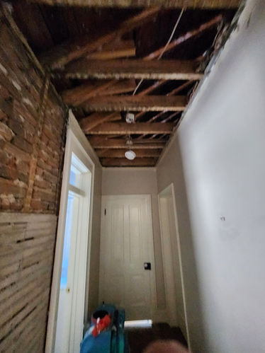 Hallway ceiling damage before renovation
