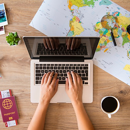 Travel advisor using booking websites to find the best vacation options for clients.