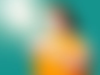 Woman with red hair embraces a large orange sphere, eyes closed, on a teal background with bright lens flare, conveying serenity.