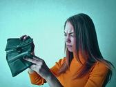woman looking at an empty purse