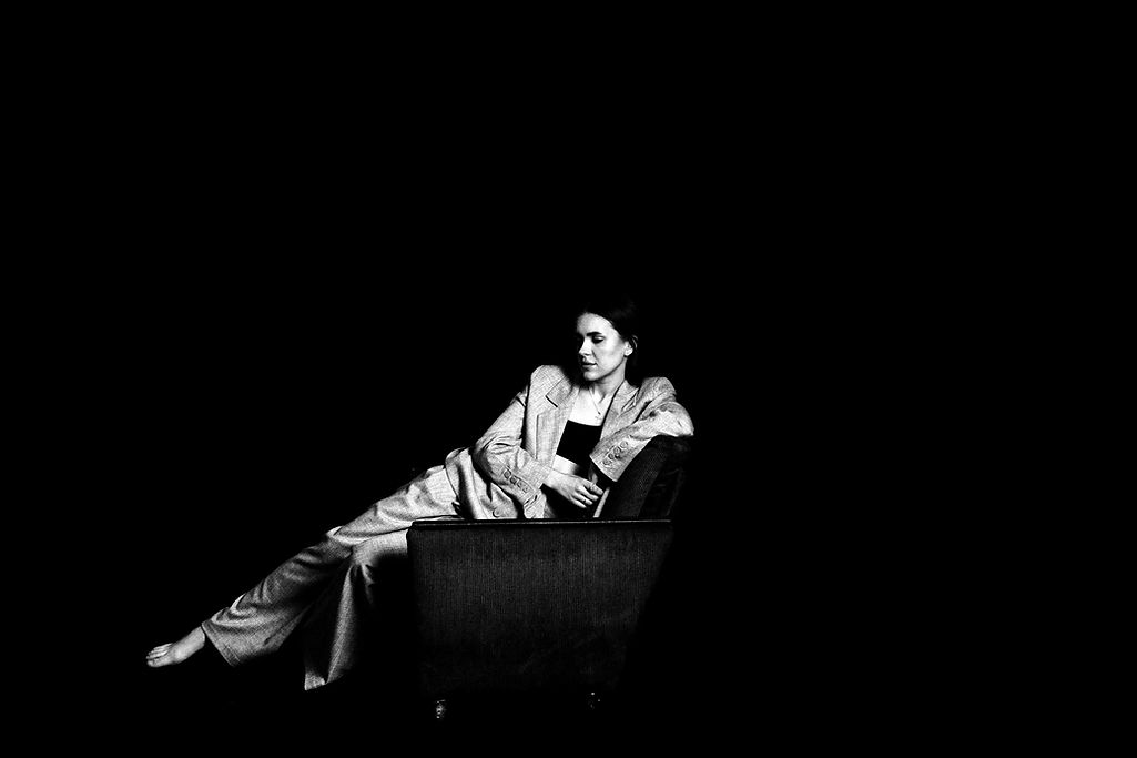 woman sitting in armchair