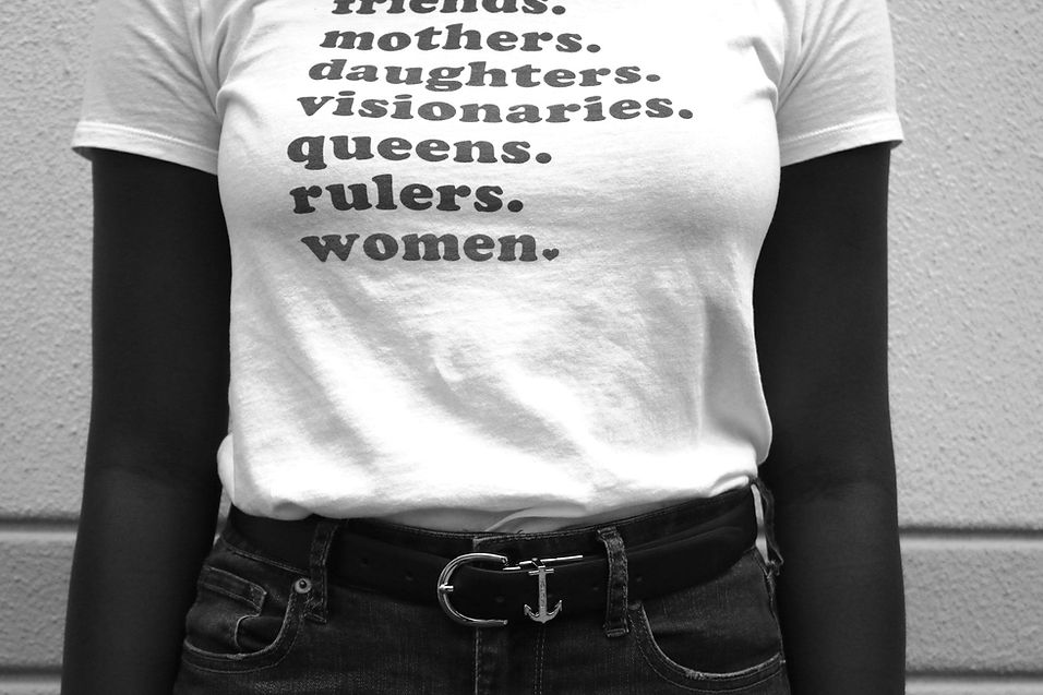 woman wearing T-Shirt writing the roles of women