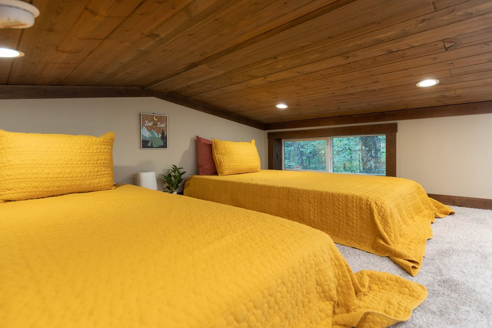 Loft bedroom in the Clayton Bankhead with cozy sleeping area.