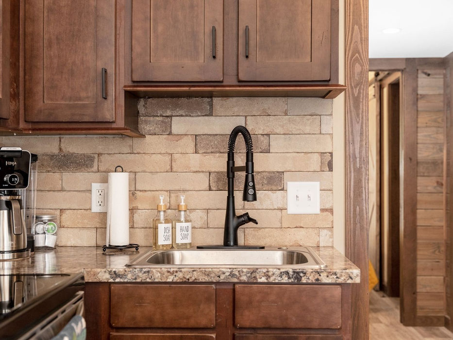 Clayton Bankhead kitchen showing sink, counter space, and cabinets.