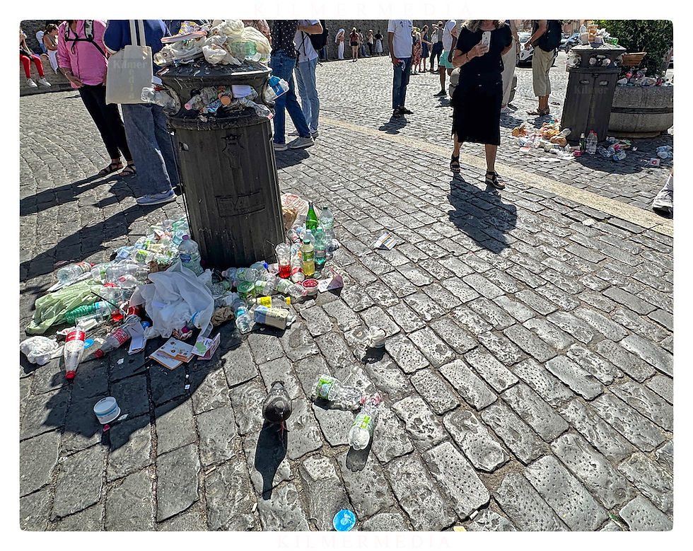 garbage overflowing a trash can in Vatican City - photo by KilmerMedia