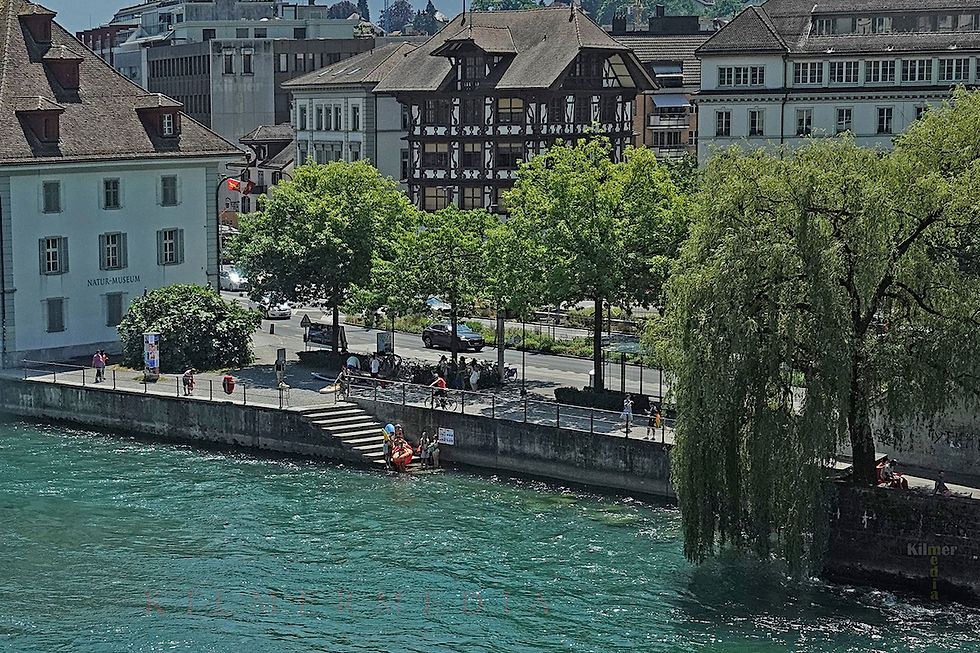 people entering the Reuss River in Lucerne, Switzerland - photo copyright by KilmerMedia, all rights reserved