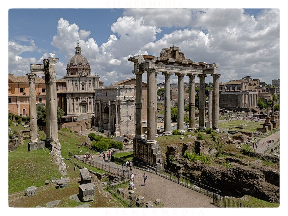 wide view of The Forum in Rome, Italy during a partly cloudy, summer day - photo by KilmerMedia