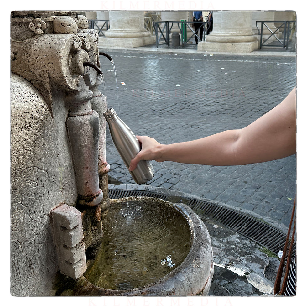 potable water from one of the historic fountains in Rome - photo by KilmerMedia