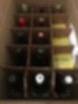 A box of twelve bottles and twelve cans of wine are shown from WSJ Wine.