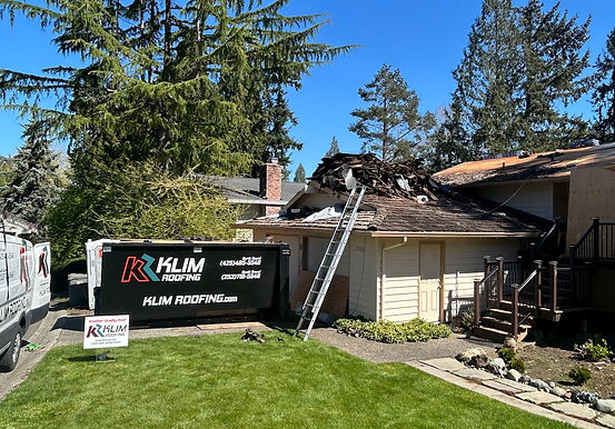 KLIM Roofing conducting a roof replacement in Auburn Washington