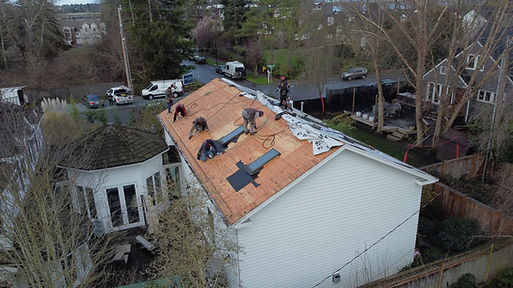 KLIM Roofing Team in the middle of a roof repair in
