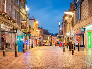 A street full of shops and exterior signage