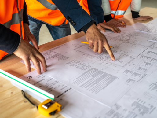 Workers consulting some plans