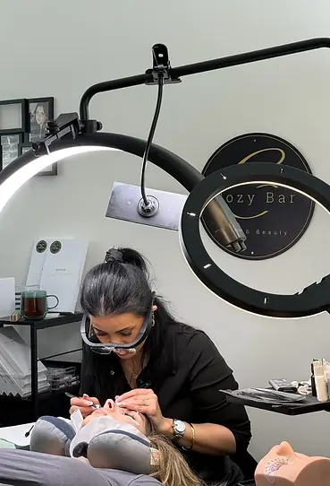 Cozy lash bar expert is applying hybrid eyelash extension bulleen client at the kew salon.