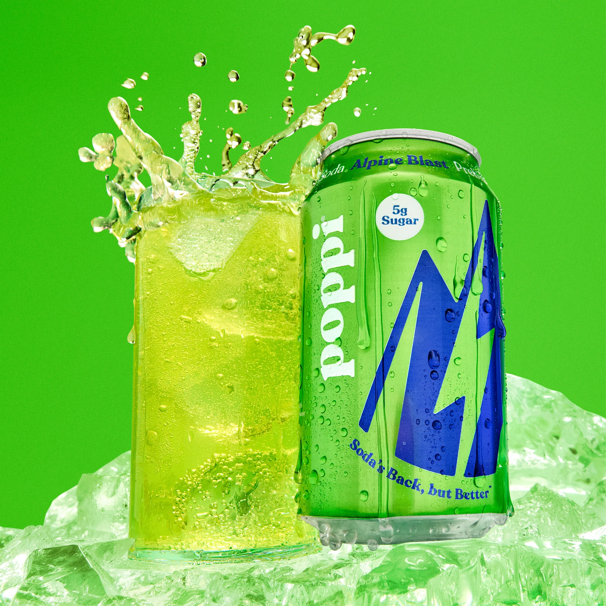 Alpine Blast Ad with a lime green soda can and a glass of soda with ice splashing into the glass
