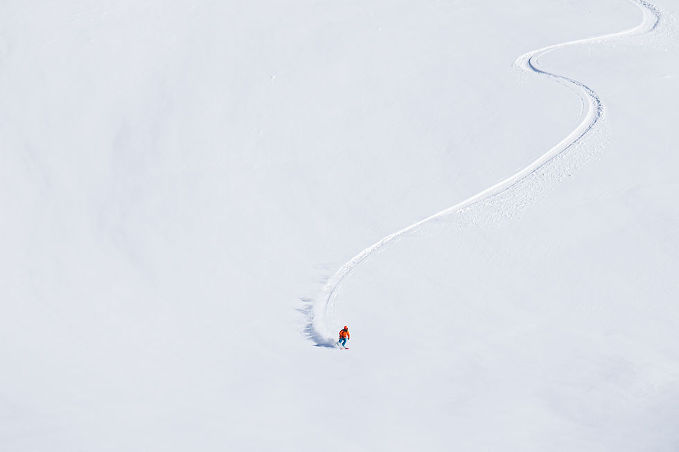 skier making fresh tracks on a powder day.