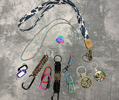 An assortment of functional and fashionable keychains, key rings, and organization accessories.