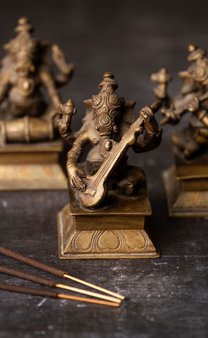 Three Ganesha statues representing an offering