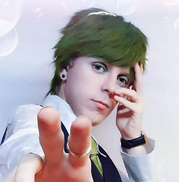 Butler shio is pointing at the camera and smirking. 