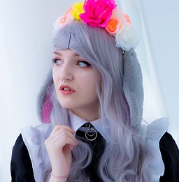Maid Yura is posing looking off to the left.
