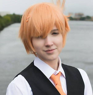 Butler Arien is posing, with his wind blowing in the air. 