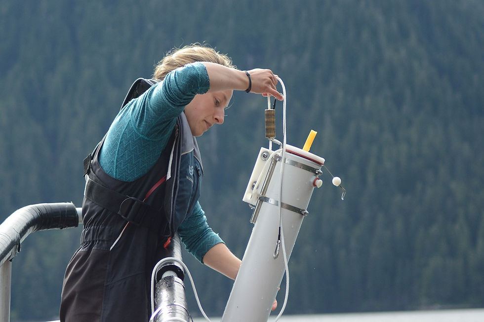Dana Bloch collecting water samples as part of her research in Southeast Alaska.