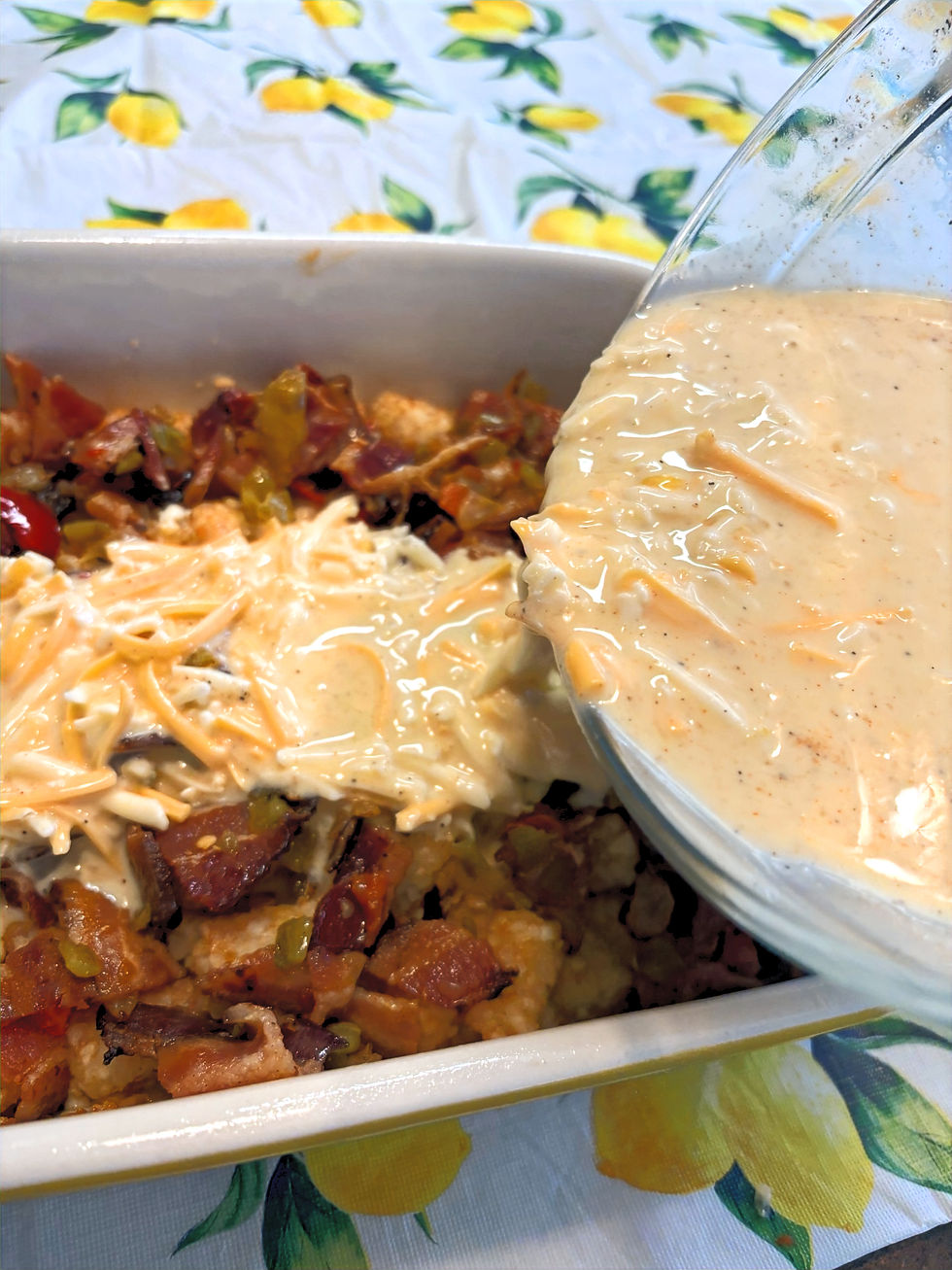 Pouring egg mixture over tater tots and bacon, onion, pepper mixture for Egg Bake from Good Stuff by Missy