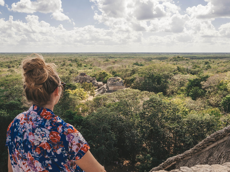 Claire from Claire's Itchy Feet sat at the top on the ruins of Ek Balam