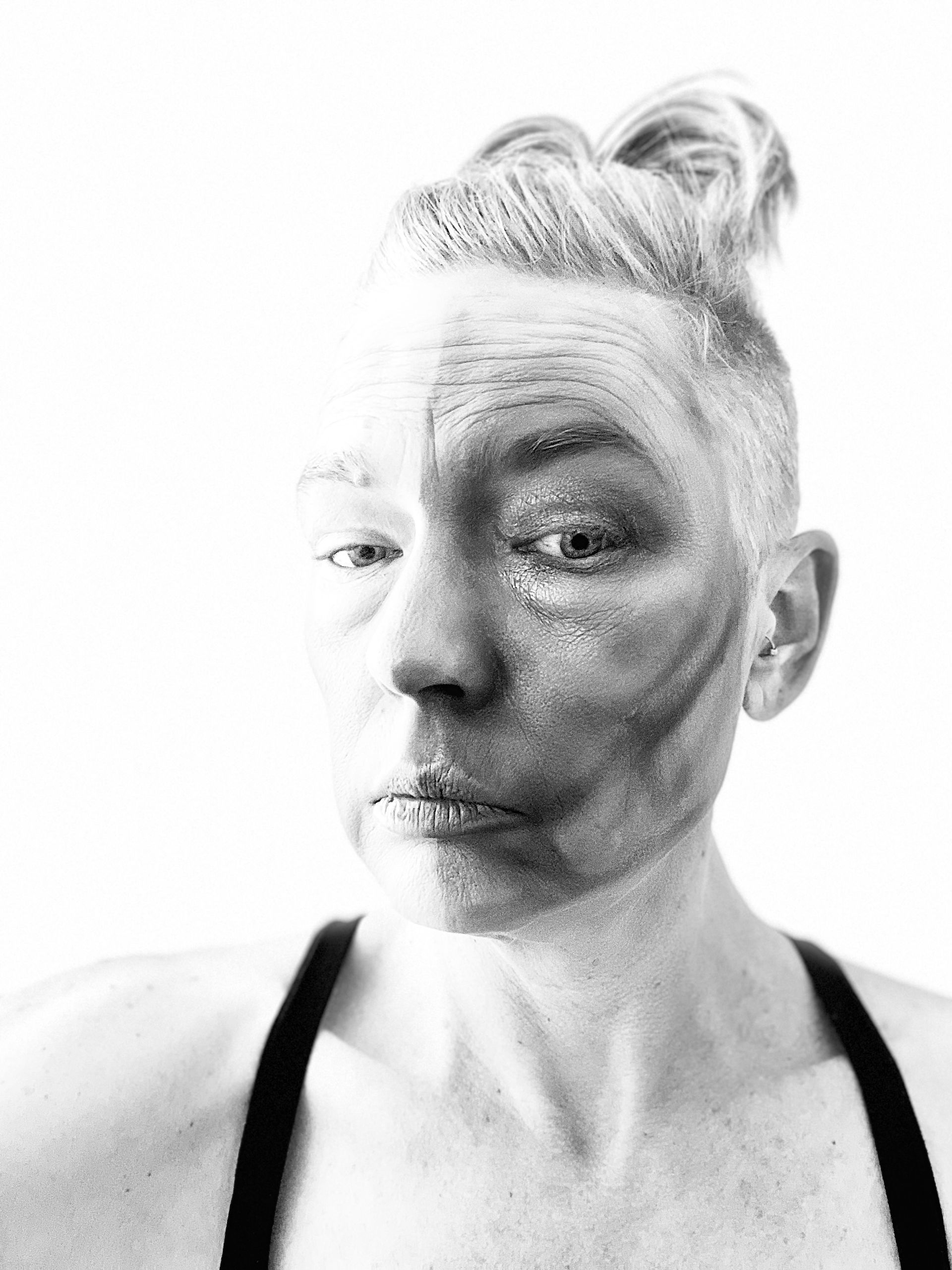 Woman using make-up to paint her face