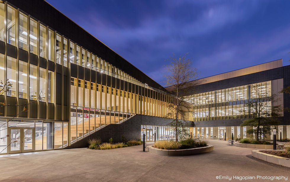 Twilight view of the Lindley Center's illuminated glass curtain wall at Santa Rosa Junior College, photographed by Emily Hagopian Photography.