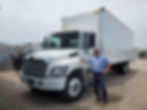 Owner Bob standing by one of his fleet trucks.