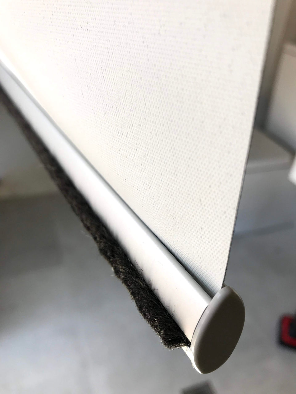 Fluffy bottom rail of a roller blind.