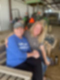 Two mom's sitting together, smiling